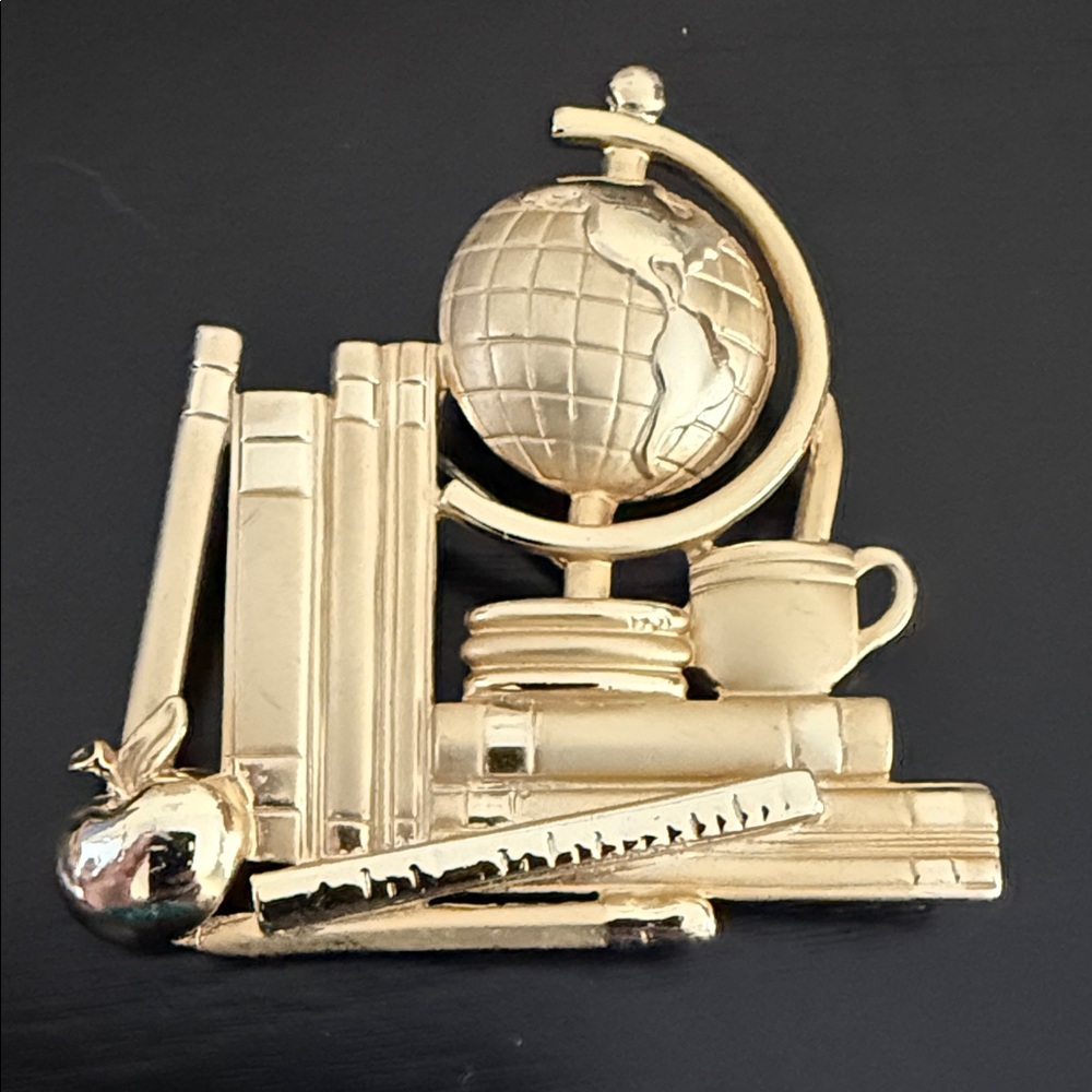 Vintage gold-tone AJC teacher-themed brooch
